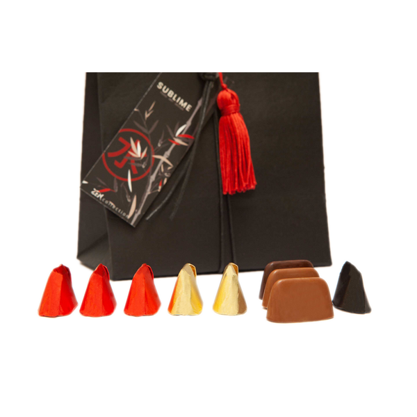 Handmade luxury gift bag with Zen graphic personalized. Content: classic and extra dark chocolate Gianduiotto and matcha tea chocolate truffles.