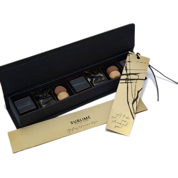 Handmade personalized luxury gift box with extra dark truffles, hazelnut and chocolate Bacetti and pistachio cremino.